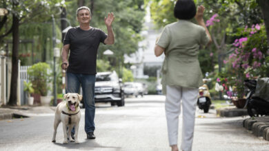 man going for a walk with his dog outdoors scaled 1