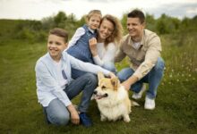 full shot happy family with cute dog scaled 1