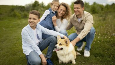 full shot happy family with cute dog scaled 1